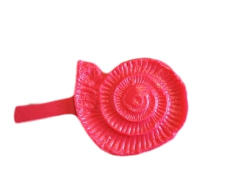 Fossilized-prehistoric-snail-shell-accent-concrete-stamp-OUT-imprint